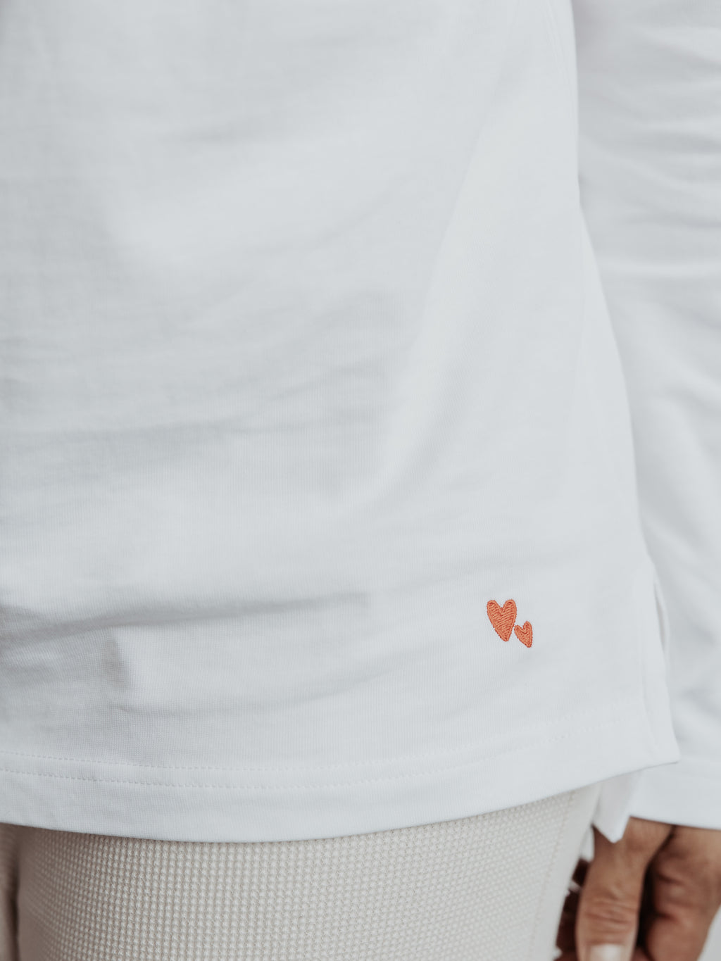 Detail of Atelier Rive Cool Longsleeve in Milk with Heart Embroidery